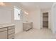 Bright bathroom features dual sinks, a large mirror, and updated fixtures at 305 Welded Tuff Trl, Castle Rock, CO 80104