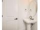 Cozy half bathroom featuring a modern vessel sink, oval mirror, and updated finishes at 305 Welded Tuff Trl, Castle Rock, CO 80104
