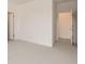 Bright bedroom featuring neutral carpet and multiple doorways for added convenience and accessibility at 305 Welded Tuff Trl, Castle Rock, CO 80104