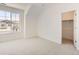 Cozy bedroom with large window and closet space, perfect for relaxation and storage at 305 Welded Tuff Trl, Castle Rock, CO 80104