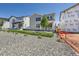 Exterior view featuring newly built homes, gravel yard, grass and modern design at 305 Welded Tuff Trl, Castle Rock, CO 80104