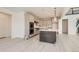 Modern kitchen with stainless steel appliances, light gray cabinets, and a large central island at 305 Welded Tuff Trl, Castle Rock, CO 80104