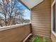 Private balcony with views of a tree and a multi-unit building in the background at 8055 E Colorado Ave # 8, Denver, CO 80231