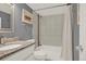 Well-lit bathroom featuring tile surround, granite countertops, and coordinated fixtures at 8055 E Colorado Ave # 8, Denver, CO 80231