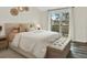 Bright bedroom with sliding glass doors leading to a private outdoor balcony at 8055 E Colorado Ave # 8, Denver, CO 80231