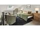 Cozy upper loft/bedroom featuring skylight, carpeting, and private sitting area at 8055 E Colorado Ave # 8, Denver, CO 80231