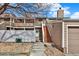 Townhouse exterior with a private entrance, steps to the front door, and adjacent garage at 8055 E Colorado Ave # 8, Denver, CO 80231
