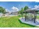 Community green space with a gazebo with seating, manicured lawn, and pool views at 8055 E Colorado Ave # 8, Denver, CO 80231