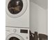 Efficient laundry area featuring a stacked washer and dryer unit at 8055 E Colorado Ave # 8, Denver, CO 80231