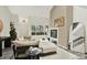Cozy living room features neutral color palette, fireplace, and view to the kitchen at 8055 E Colorado Ave # 8, Denver, CO 80231