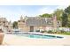 Community swimming pool with a large deck and lounge chairs at 8055 E Colorado Ave # 8, Denver, CO 80231