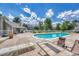 Resort-style pool with lounge seating, beautiful landscaping, and blue skies at 8055 E Colorado Ave # 8, Denver, CO 80231