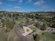 Expansive aerial view of home nestled among trees, showcasing mountain views and neighborhood at 22081 Paradise Cir, Golden, CO 80401