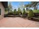 Backyard patio with terraced landscaping, featuring wooden retaining walls and lush greenery for outdoor enjoyment at 22081 Paradise Cir, Golden, CO 80401