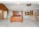 Spacious bedroom featuring carpeted floors, staircase, a ceiling fan, and ample natural light at 22081 Paradise Cir, Golden, CO 80401