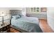Comfortable bedroom showcasing a plush bed, soft blue bedding, and natural light from the window at 22081 Paradise Cir, Golden, CO 80401