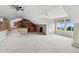 Large bonus room featuring a stone fireplace, wet bar, and ample space for entertaining or relaxing at 22081 Paradise Cir, Golden, CO 80401
