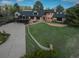Charming two-story brick home with a deck, lush lawn and mature trees surrounding the property at 22081 Paradise Cir, Golden, CO 80401