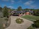 Beautiful multi-story brick home with a circular driveway and professionally landscaped front yard at 22081 Paradise Cir, Golden, CO 80401
