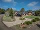 Beautiful multi-story brick home with a circular driveway and professionally landscaped front yard at 22081 Paradise Cir, Golden, CO 80401