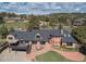 Stunning brick home featuring a spacious deck, curved entry, and lush landscaping at 22081 Paradise Cir, Golden, CO 80401