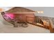 Unique loft featuring a brick and stone structure with custom stonework and a cozy wet bar at 22081 Paradise Cir, Golden, CO 80401