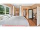 Spacious main bedroom with walk-in closet and access to bathroom and stairwell at 22081 Paradise Cir, Golden, CO 80401