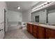 This spacious bathroom is equipped with a double sink vanity, and a soaking tub at 2239 Calais Dr # E, Longmont, CO 80504