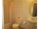 Clean bathroom featuring a toilet, sink, and shower/tub combo at 2239 Calais Dr # E, Longmont, CO 80504