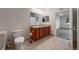 This bathroom is equipped with a double sink vanity and tile floors at 2239 Calais Dr # E, Longmont, CO 80504