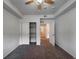 This bedroom features a walk in closet and neutral colored carpet at 2239 Calais Dr # E, Longmont, CO 80504