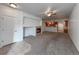 Spacious living room featuring a cozy fireplace and seamless flow into the adjacent kitchen at 2239 Calais Dr # E, Longmont, CO 80504