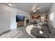 Staged living room with a fireplace, modern furniture, and an open layout to the kitchen at 2239 Calais Dr # E, Longmont, CO 80504