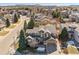 Aerial view of a home in a residential neighborhood, showcasing its curb appeal and surrounding landscape at 2792 Greatwood Way, Highlands Ranch, CO 80126