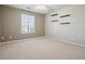 Neutral bedroom with two windows, ceiling fan and simple shelving at 2792 Greatwood Way, Highlands Ranch, CO 80126