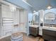 Bathroom area with double vanities, unique lighting, and a large walk-in closet at 22 S Indiana Pl, Golden, CO 80401