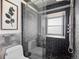 Modern bathroom with tiled shower, glass door, and stylish fixtures at 22 S Indiana Pl, Golden, CO 80401