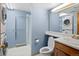 Efficient bathroom with a combined washer and dryer, plus a shower with glass door at 22 S Indiana Pl, Golden, CO 80401