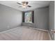 This carpeted bedroom has grey walls and a ceiling fan at 22 S Indiana Pl, Golden, CO 80401