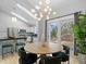 Bright dining area with skylights, stylish chandelier, and a sliding glass door to backyard at 22 S Indiana Pl, Golden, CO 80401