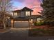 Charming two-story home with attached two car garage and beautifully landscaped front yard at sunset at 22 S Indiana Pl, Golden, CO 80401