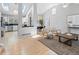 Bright and airy living room featuring skylights, vaulted ceilings, and hardwood floors at 22 S Indiana Pl, Golden, CO 80401