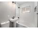 This updated bathroom features subway tile surround, a shower/tub combo and modern fixtures at 5100 Clay St, Denver, CO 80221
