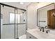 Bathroom featuring a glass shower door, sleek black fixtures and white countertops at 5100 Clay St, Denver, CO 80221