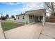 This home has a convenient carport and a well-maintained lawn with mature trees at 5100 Clay St, Denver, CO 80221