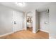 Hallway area with hardwood floors and views of the laundry area and kitchen at 5100 Clay St, Denver, CO 80221
