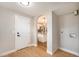 Entryway with wood floors and a view to the kitchen with a granite countertop at 5100 Clay St, Denver, CO 80221