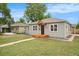 Charming single-story home with a well-maintained lawn and inviting curb appeal at 5100 Clay St, Denver, CO 80221