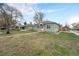 Charming single-story home with meticulous landscaping, well-maintained lawn and mature trees at 5100 Clay St, Denver, CO 80221