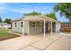 Home with a covered front entrance, large front yard and driveway at 5100 Clay St, Denver, CO 80221